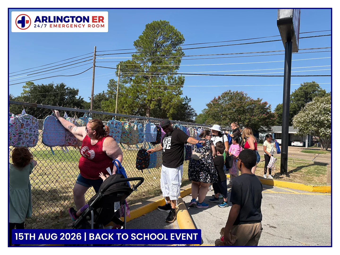 Families collecting free backpacks at the Arlington ER